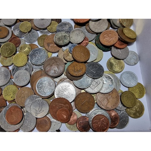 294 - A box containing a large quantity of various vintage coins from around the world.