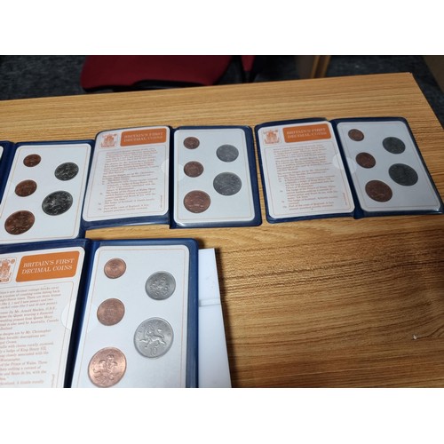 296 - A large bundle of 10x vintage Britain's first decimal coin sets, all in their wallets.