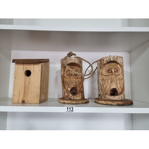 113 - 2x log formed owl carved bird feeders along with a wooden bird box 22cm high 15cm diameter