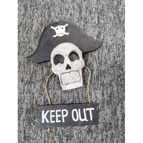 45 - Quantity of fairtrade wooden items inc skull and cross bones door hangers, wind chimes, 5x shelf sit... 