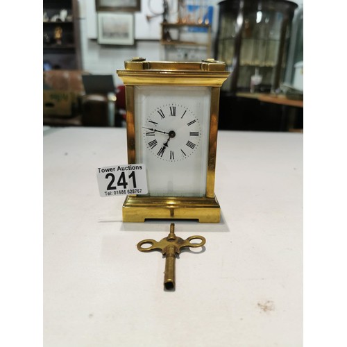 230 - Good quality early vintage brass carriage clock with a visible escapement to the top bevel edge glas... 