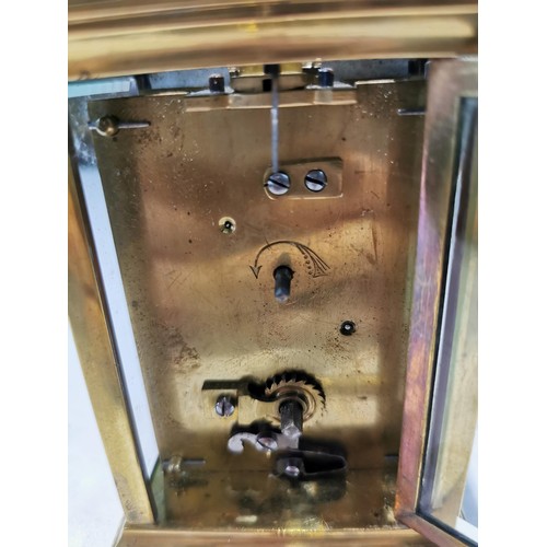 230 - Good quality early vintage brass carriage clock with a visible escapement to the top bevel edge glas... 