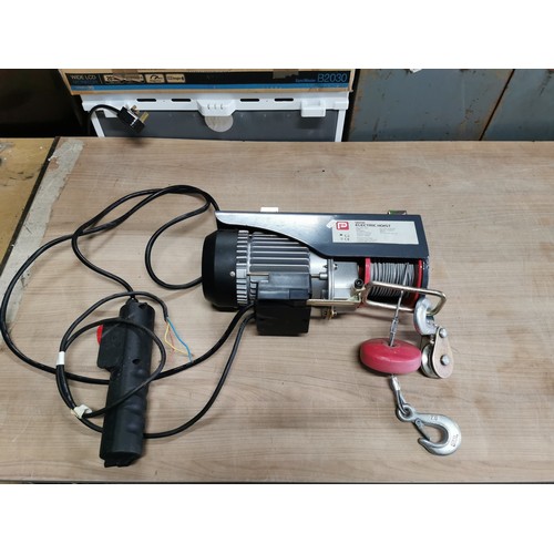 63 - Performance power 560w electric heavy duty hoist max 250kg with controller needs a plug, model no. N... 