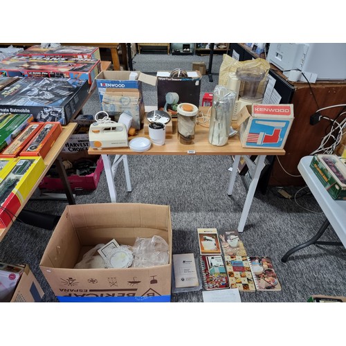 202 - A box containing a large quantity of vintage kitchen appliances. to include a Kenwood mixer, a Kenwo... 