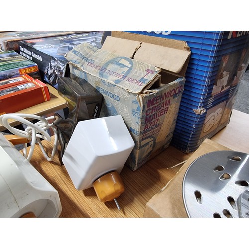 202 - A box containing a large quantity of vintage kitchen appliances. to include a Kenwood mixer, a Kenwo... 