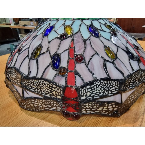 227 - A pretty Tiffany style art glass lampshade with a dragonfly design, displays well, has a small bit o... 