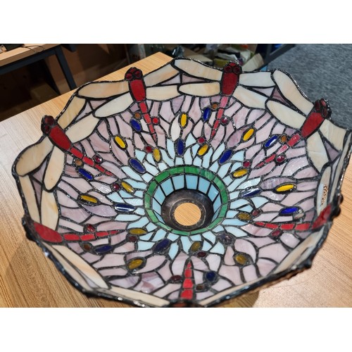 227 - A pretty Tiffany style art glass lampshade with a dragonfly design, displays well, has a small bit o... 