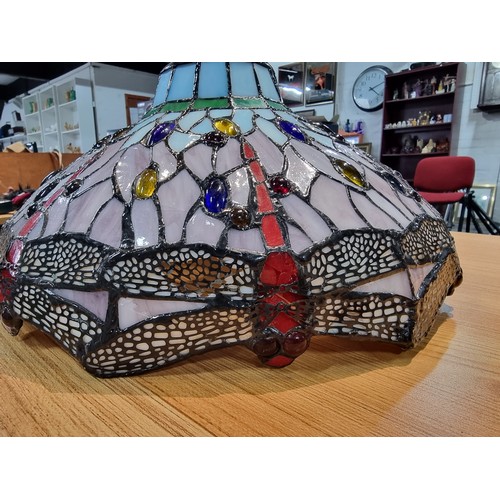 227 - A pretty Tiffany style art glass lampshade with a dragonfly design, displays well, has a small bit o... 