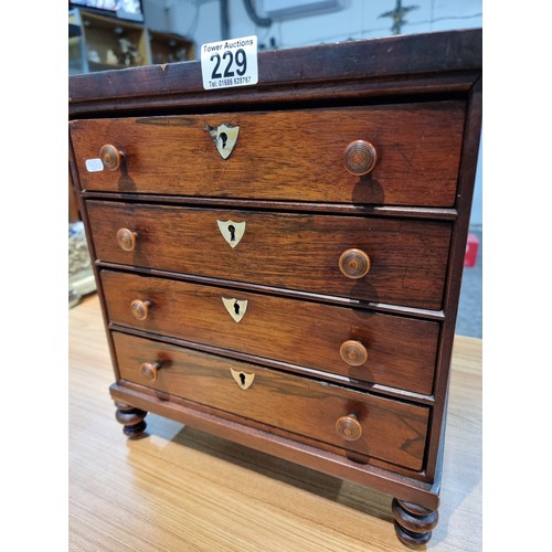 229 - A good quality antique Victorian table top chest of 4 drawers with small turned bun handles standing... 