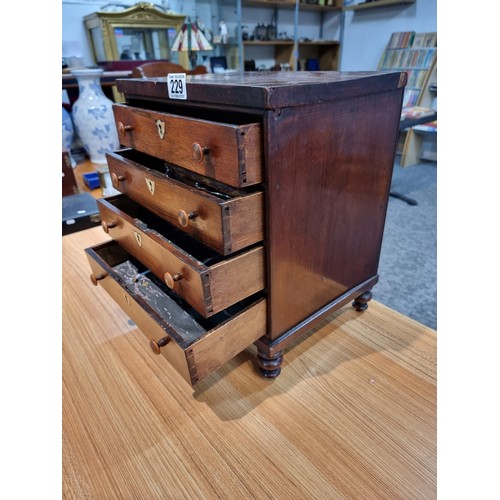 229 - A good quality antique Victorian table top chest of 4 drawers with small turned bun handles standing... 