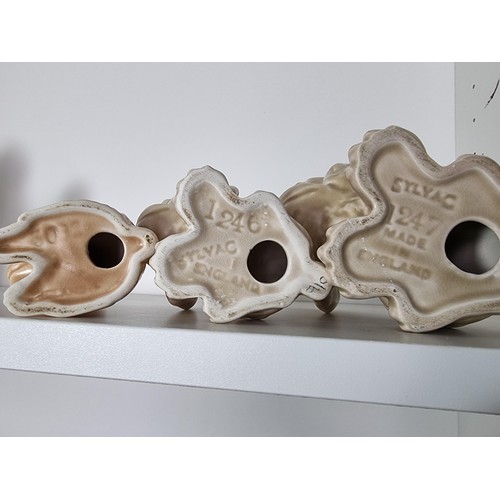 135C - 2 matching graduated sets of Sylvac ceramic dogs to include a set of 3 sad long eared dogs and a set... 