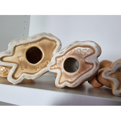 135C - 2 matching graduated sets of Sylvac ceramic dogs to include a set of 3 sad long eared dogs and a set... 