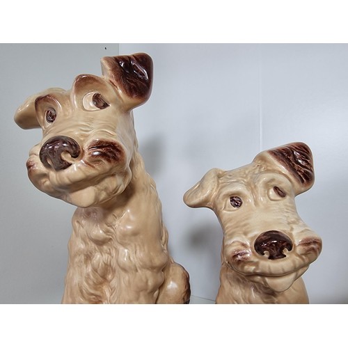 135D - A rare vintage set of graduated dogs by Sylvac to include a set of 3 graduated brown terrier dogs, a... 