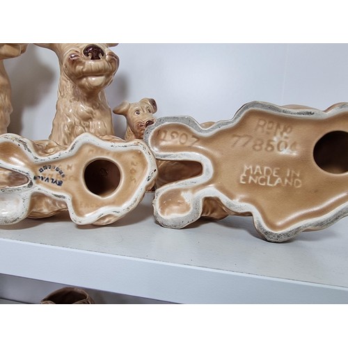 135D - A rare vintage set of graduated dogs by Sylvac to include a set of 3 graduated brown terrier dogs, a... 