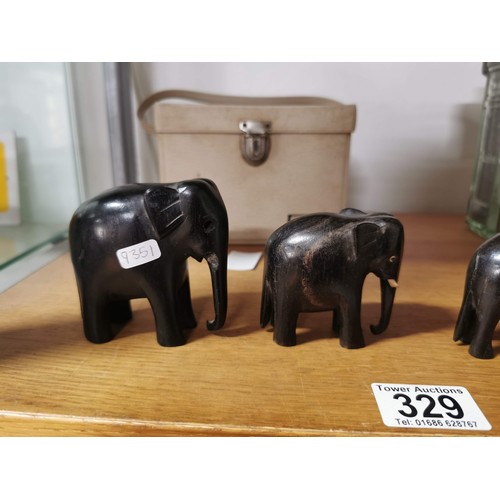 329 - 5x solid ebony graduated elephant figures, some of the elephants have tusks missing