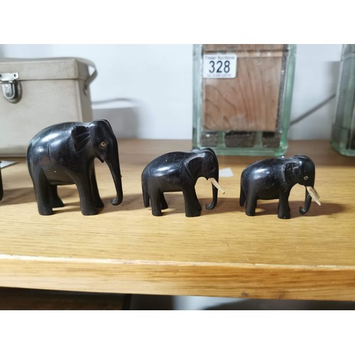 329 - 5x solid ebony graduated elephant figures, some of the elephants have tusks missing