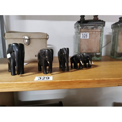 329 - 5x solid ebony graduated elephant figures, some of the elephants have tusks missing