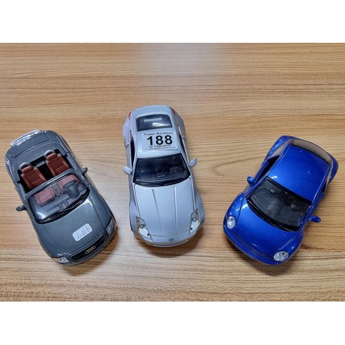 188 - 3 large die-cast model cars by Maisto, all are 1/4 scale to include an Audi TT, a Nissan 350Z and Vo... 