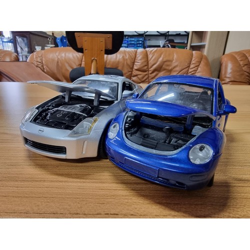 188 - 3 large die-cast model cars by Maisto, all are 1/4 scale to include an Audi TT, a Nissan 350Z and Vo... 