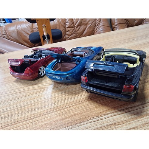 189 - A collection of 4 times large die-cast model cars all are 1/24 scale, 3 are by Maisto and 1 by Schab... 