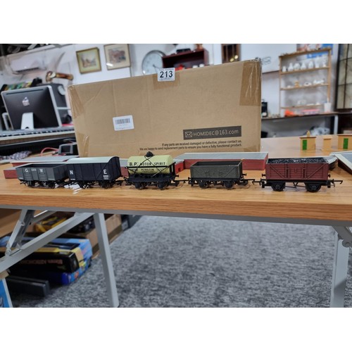 213 - A box full of OO gauge mode railway accessories to include a quantity of Hornby resin platform piece... 