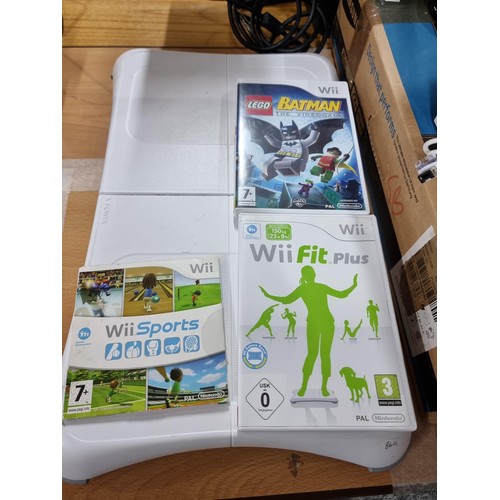 222 - A comprehensive Nintendo Wii set to include the Wii console, 2 Wii chargeable controllers and dockin... 