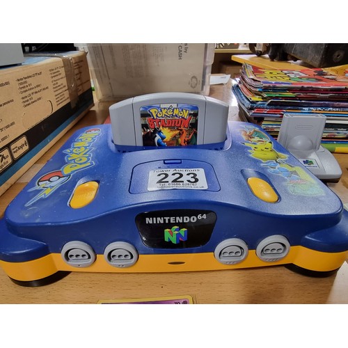 223 - A limited edition Nintendo 64 Pokémon edition console complete with 5 games, controller (No power le... 