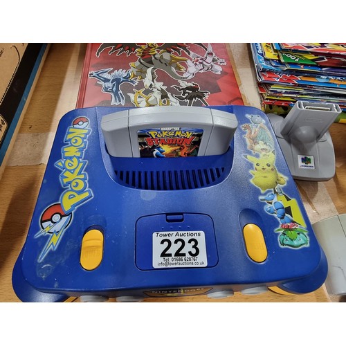 223 - A limited edition Nintendo 64 Pokémon edition console complete with 5 games, controller (No power le... 