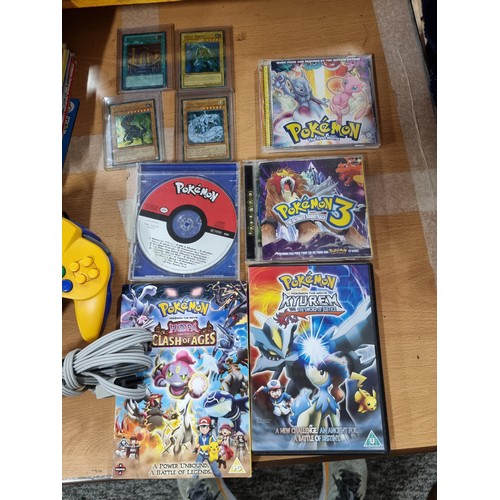 223 - A limited edition Nintendo 64 Pokémon edition console complete with 5 games, controller (No power le... 