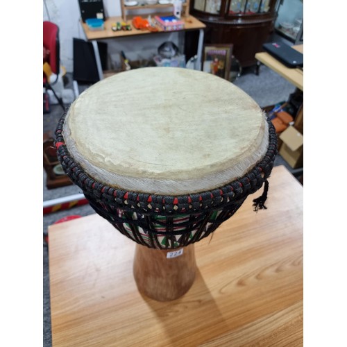 224 - A large good quality Djembe drum of very good quality construction, featuring a good drum skin which... 