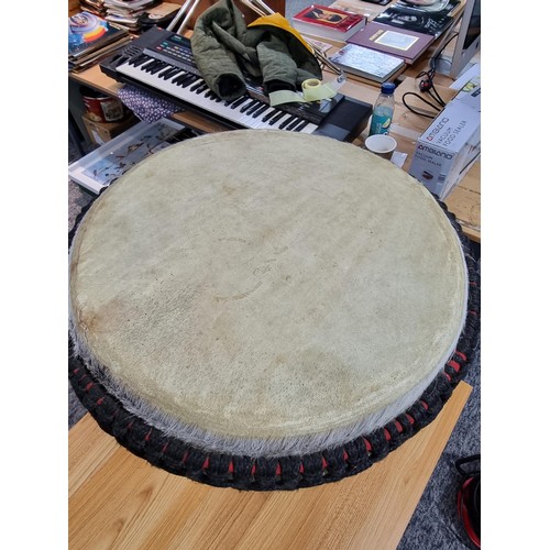 224 - A large good quality Djembe drum of very good quality construction, featuring a good drum skin which... 