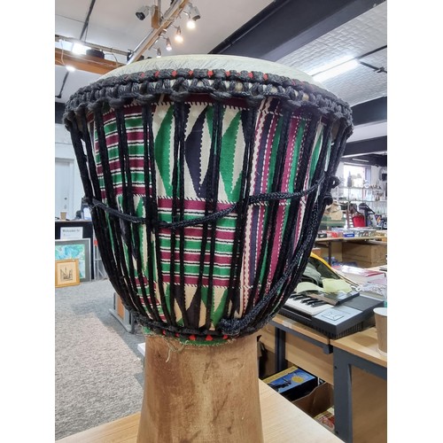 224 - A large good quality Djembe drum of very good quality construction, featuring a good drum skin which... 