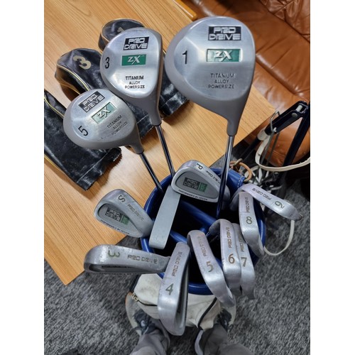 226 - A complete golf set by pro drive to include a full set of irons 3 woods and a putter from the ZX ran... 