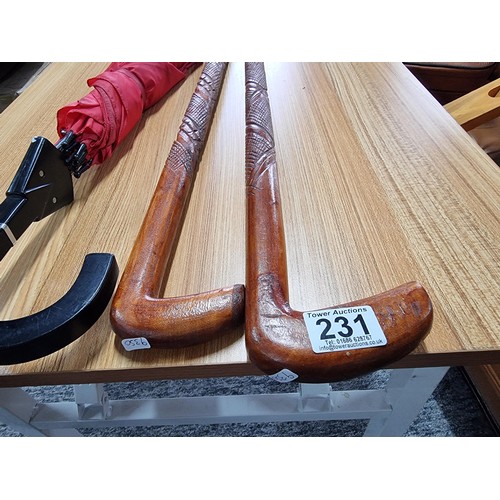 231 - An unusual double umbrella for 2 people by Cincinnati Milacron along with 2 good solid wood walking ... 