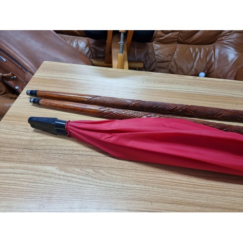 231 - An unusual double umbrella for 2 people by Cincinnati Milacron along with 2 good solid wood walking ... 