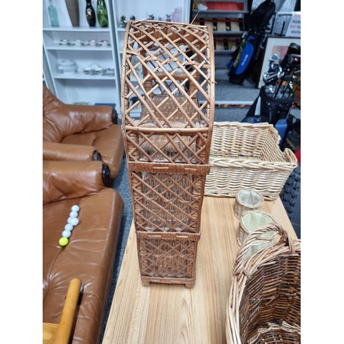 233 - A quantity of wicker items to include an arched wicker shelfing unit, (can be hung or free standing)... 