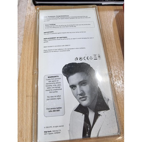 242 - A lot all relating to Elvis Presley, to include 4 hardback books, a collectors edition Elvis watch a... 