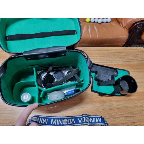 245 - A comprehensive vintage 35mm camera setup to include a Minolta X-700 camera, complete with 4 lenses,... 