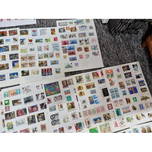 249 - A very large quantity of organised stamps all on pieces of card, containing stamps from around the w... 