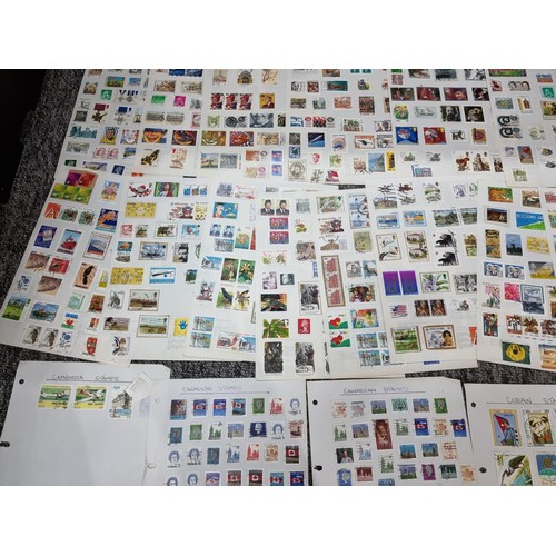 249 - A very large quantity of organised stamps all on pieces of card, containing stamps from around the w... 