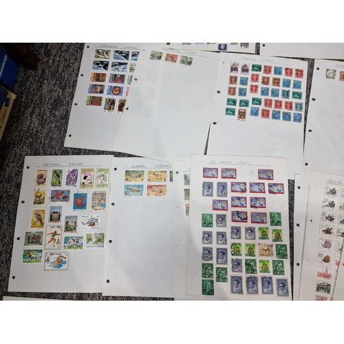 249 - A very large quantity of organised stamps all on pieces of card, containing stamps from around the w... 