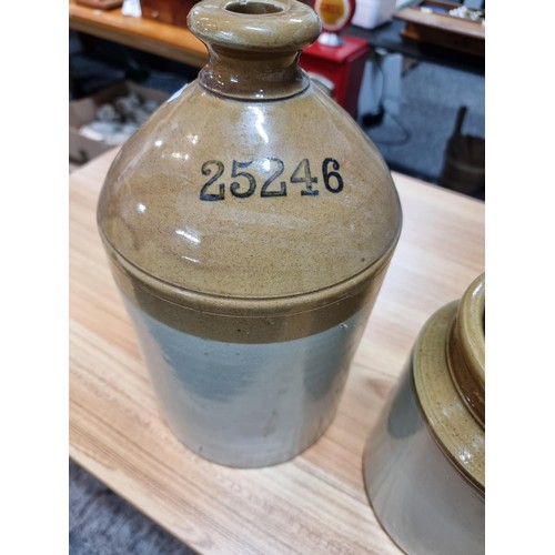 264 - A vintage stoneware flagon along with a large stoneware pot, the stoneware flagon is marked for Ind ... 