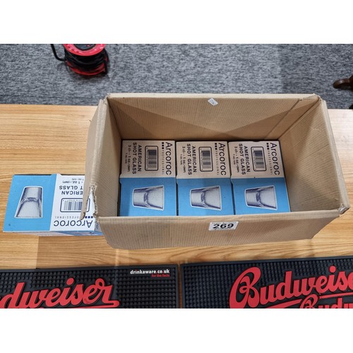 269 - A 48x brand new shot glasses by Arcoroc in 4 boxes along with 2x Budweiser rubber bar matts.