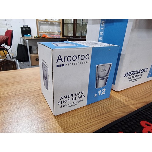 269 - A 48x brand new shot glasses by Arcoroc in 4 boxes along with 2x Budweiser rubber bar matts.