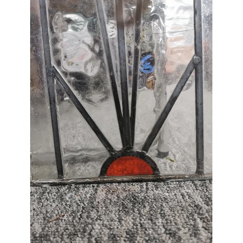 2 - pair of stain glass windows with orange and green design. One of the pains has damage, otherwise in ... 