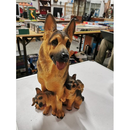 12 - 2x resin Alsatian dogs in good order largest measures height 32cm base diameter 20cm