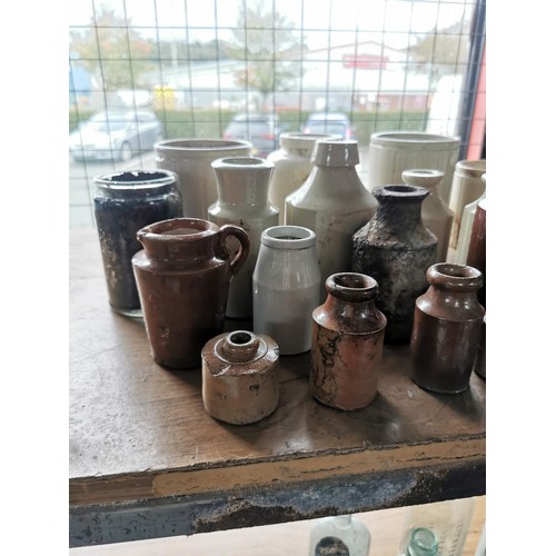 24 - Large quantity of 24x stoneware and earthen ware bottles and pots of various sizes 14x are cream 10x... 