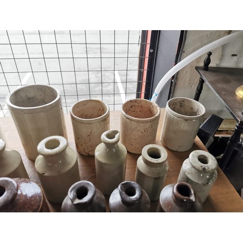 24 - Large quantity of 24x stoneware and earthen ware bottles and pots of various sizes 14x are cream 10x... 