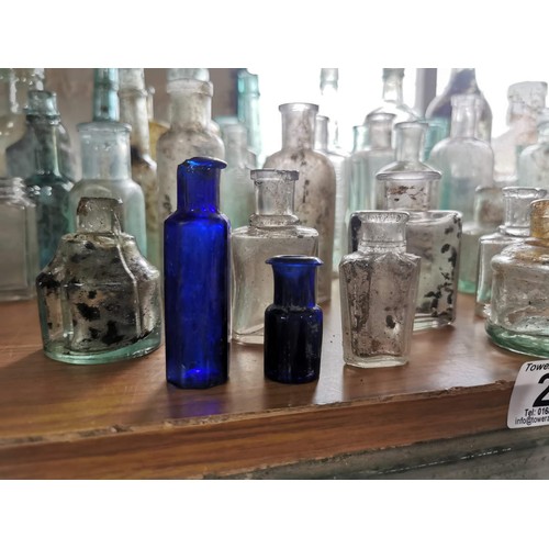 25 - Large quantity 46x of vintage and antique glass bottles some are branded Couchs Whooping Cough and A... 