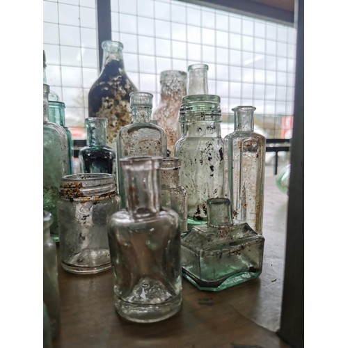 25 - Large quantity 46x of vintage and antique glass bottles some are branded Couchs Whooping Cough and A... 